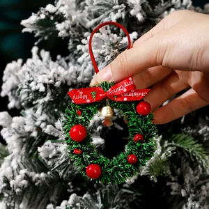 Decorative mini green Christmas wreath pendant with red bow and gold bell for trees