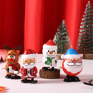Set aus vier bunten Weihnachts-Aufziehspielzeugen mit Weihnachtsmann und Schneemann.