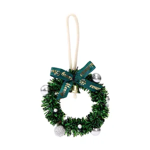 Mini Christmas wreath ornament with green bow and gold bell for car and tree decor