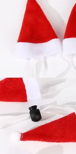 Detailed close-up showing texture of mini Santa hats for pets with adjustable straps