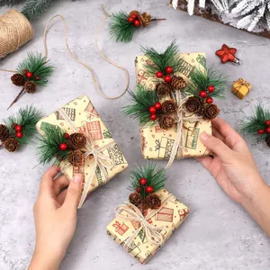 Festive Christmas pine needle picks with natural cones and red berries on gifts