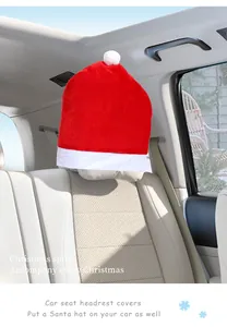 Detail view of red Santa hat car headrest cover in a bright vehicle interior
