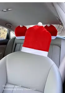 Santa hat car headrest covers installed on gray leather vehicle seats for Christmas