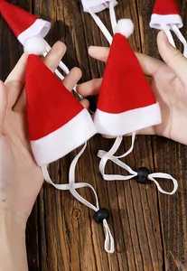 Detailed view of small pet Christmas hats with adjustable elastic straps