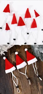 Detailed view of mini Santa hats for pets with adjustable white elastic straps