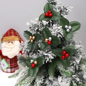 Decorative Christmas holly berry stems with green leaves and red gold silver berries
