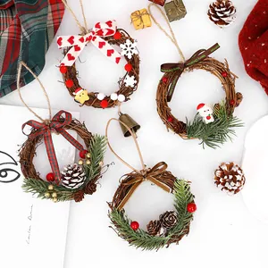 Set of 4 mini Christmas rattan wreaths with pinecones and bows for festive decor.