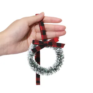 Mini frosted Christmas wreath decoration with red and black buffalo plaid ribbon bow