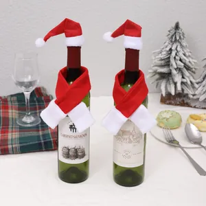 Festive Christmas wine bottle decoration set featuring mini Santa hats and red scarves