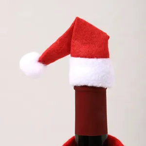 Detailed close-up view of a mini red and white Santa hat used for Christmas wine bottle decoration.