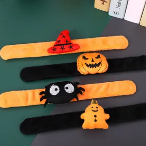 Macro detail showing soft plush textures of Halloween slap bracelets featuring spooky characters.