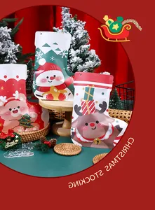 Detail of festive Christmas stocking candy bags with snowman and reindeer prints.