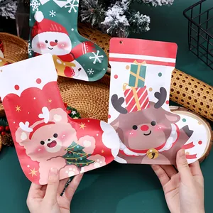 Festive stocking-shaped Christmas candy bags with snowman, bear, and reindeer designs