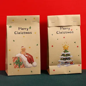 Zwei Weihnachts-Geschenktüten aus Kraftpapier mit Merry Christmas Text und Motiven