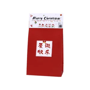 Bolsa de regalo de Navidad de papel kraft rojo festivo con etiqueta "Merry Christmas"