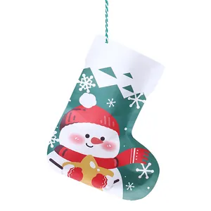 Stocking-shaped Christmas gift bag featuring a cute snowman design for holiday decor