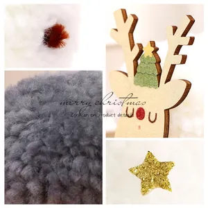 Festive wooden reindeer Christmas ornament set with plush pom-poms and gold glitter star