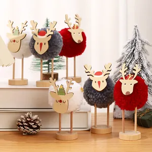 Creative Christmas reindeer ornaments with colorful pompoms and wooden stands