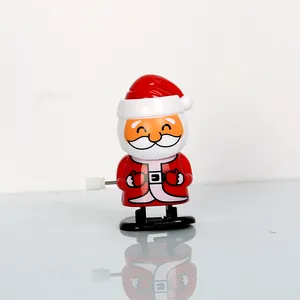 Klassisches Weihnachtsmann-Aufziehspielzeug als Weihnachtsgeschenk mit Spiegelung