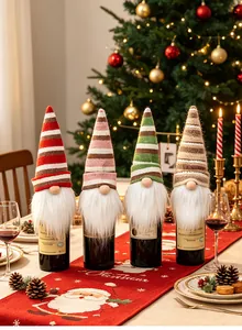 Festive set of four colorful striped knitted gnome wine bottle covers on a Christmas table.