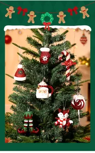 Selection of festive red and white ornaments hanging on a decorated Christmas tree