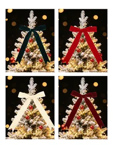 Set of four velvet Christmas bows in green, red, cream, and burgundy on a tree.