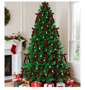 Small red velvet Christmas bows decorating a green festive tree in a cozy home setting