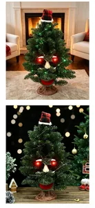 Detailed view of a glowing electric Christmas tree with an animated face and plaid hat
