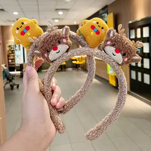 Cute plush Christmas headband with reindeer antlers and gingerbread man figures