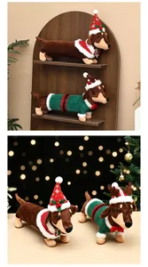 Two festive dachshund plush toys wearing Christmas outfits displayed in a warm holiday scene