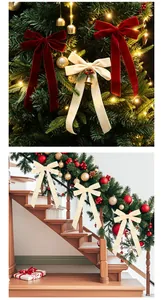 Showcasing red and cream velvet Christmas bows decorated on a festive tree and staircase