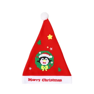 Handmade DIY Christmas felt hat for kids with cartoon penguin and Merry Christmas text