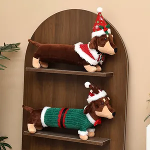 Two festive dachshund plush dogs wearing cute Christmas outfits on a wooden shelf