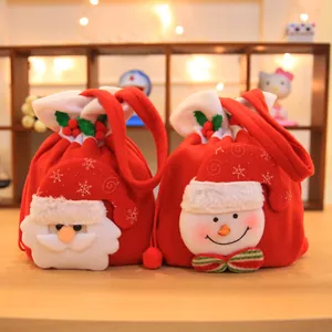 Festive red Christmas candy gift bags featuring plush Santa and Snowman designs for kids
