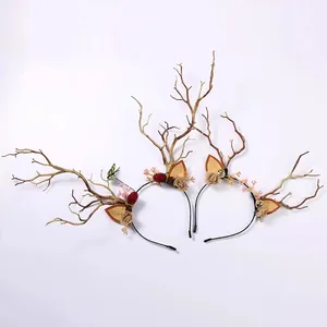 Detailed macro view of a fairy-style reindeer antler headband with flowers and butterflies