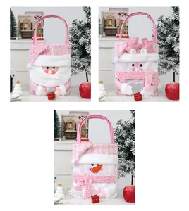 Juego de tres bolsas de regalo de Navidad rosas con detalles de Papá Noel y muñeco.