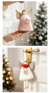 Detailed view of plush Christmas angel hanging ornaments in pink and white colors