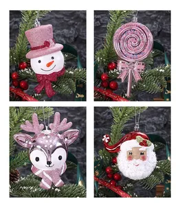 Close-up of four glittery Christmas ornaments featuring snowman, reindeer, and lollipop