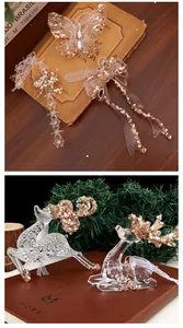 Close-up view of elegant transparent acrylic Christmas ornaments with sparkling gold sequins.