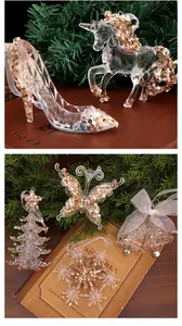 Close-up of glittery acrylic Christmas ornaments including unicorns and crystal shoes.