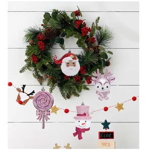 Macro view of cute Christmas ornaments including Santa, Snowman and lollipop details