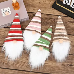 Set of 4 festive Christmas gnome wine bottle covers featuring knitted striped hats