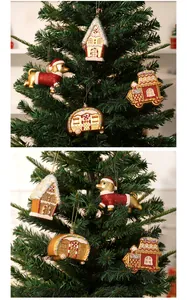 Scene shot of red and gold Christmas tree ornaments including dachshund and gingerbread house