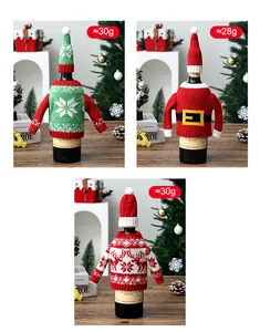 Lot de trois cache-bouteilles de vin de Noël en tricot festif avec pulls et bonnets