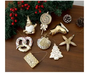 Collection of golden electroplated Christmas ornaments in various festive shapes