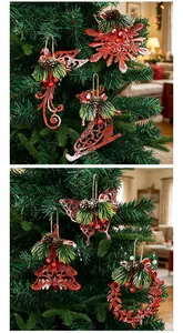 Close-up of red vintage-style Christmas tree ornaments hanging on pine branches