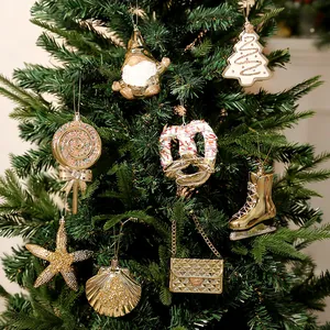 Set of assorted gold electroplated Christmas tree ornaments in various festive holiday shapes