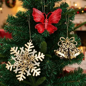 Festive red and gold Christmas tree hanging ornaments including butterfly and snowflake.