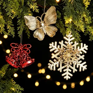 Elegant gold and red Christmas tree ornaments set with snowflake and butterfly shapes
