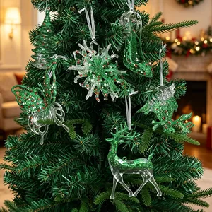 Set of green glittery Christmas tree hanging ornaments with reindeer and snowflakes